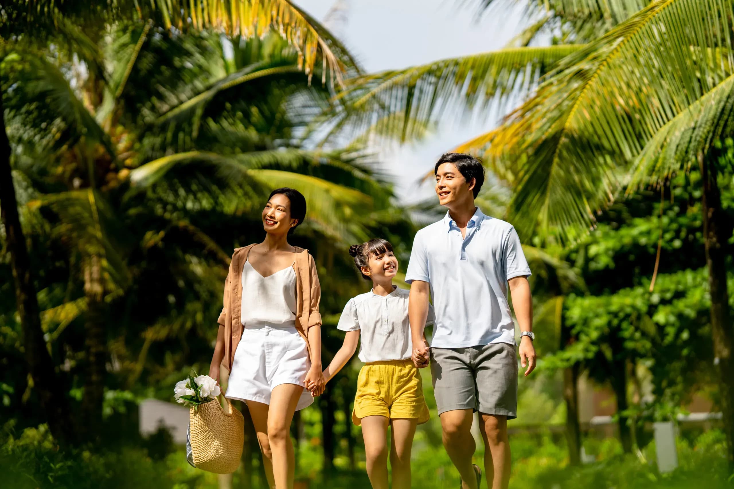 Happy family strolling in the lush, serene natural setting.