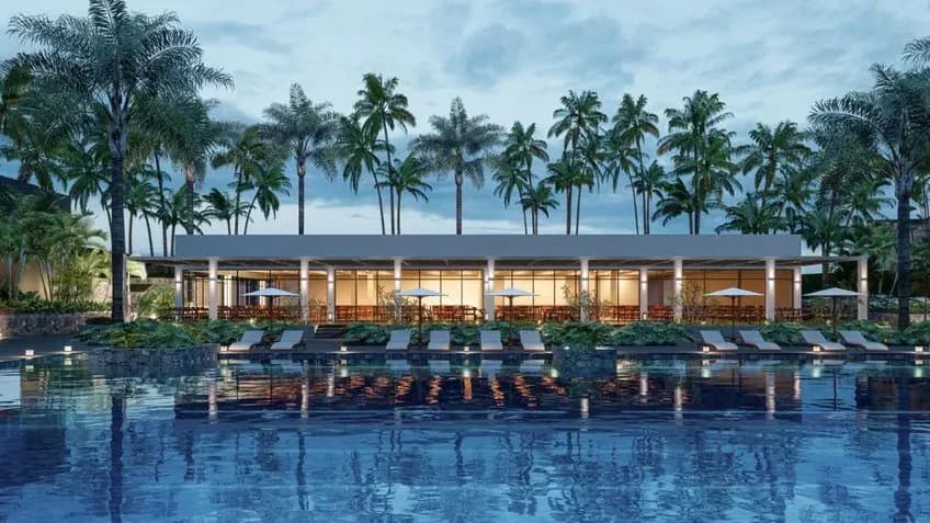 Modern pool and ideal relaxation area amidst the lush setting of the resort.