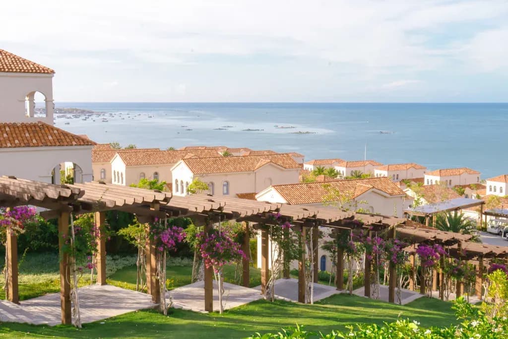 Lush greenery and distant blue sea